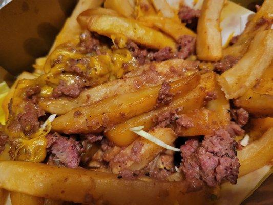 Uncooked fries and meat
