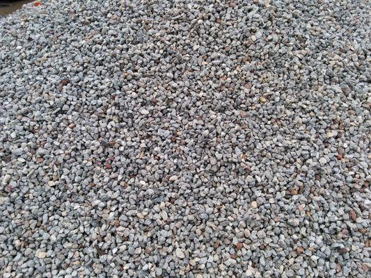 57 Rock. Also referred to as 3/4" Rock. Natural Sone from the Quarry, or maybe Metal Laden recycled concrete