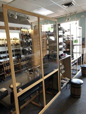 Plexiglass dividers to provide safe space for customers during fitting.