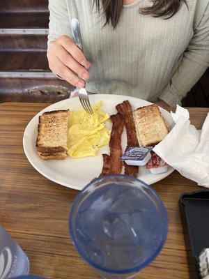 Scrambled eggs, toast and bacon.
