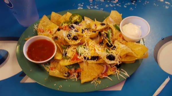 This is a $9 nacho. Not a lot for the money and not the best tasting. Who puts raw jalapeños on nachos?