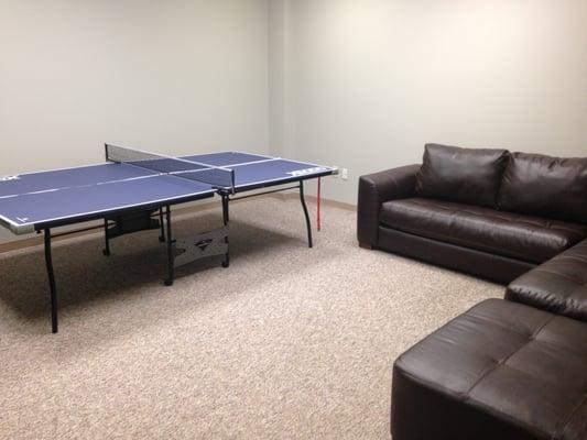 Ping pong and two comfy couches.  It's concrete too so it's fairly quiet.  Ahhhh!   :)