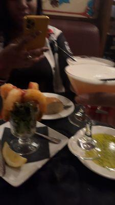 Shrimp Cocktail, Martini, garlic bread with butter sauce