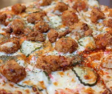 Artisan crust, roasted red bell pepper dip, dill pickles, spicy marinated fried chicken & topped with honey sriracha.