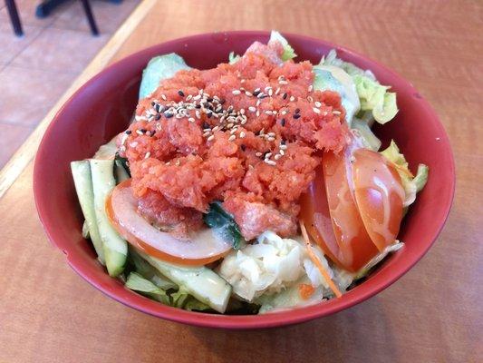 Spicy Tuna bowl- Tuna, fresh lettuce tomato cucumber avocado, sesame ginger dressing, on top sticky rice. Dressing is lights out.