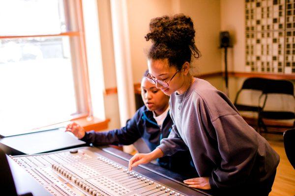 Students are able to record and produce original music using HNA's recording studio and production lab.