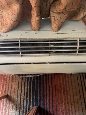 Broken air conditioning unit and dirty floor