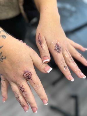 Fine line finger tattoos