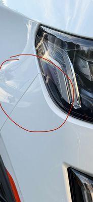 Damage on bumper under headlamp
