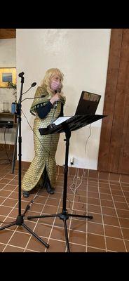 Katherine reading whale poem in mermaid dress at Shindig, The Sea Ranch 16MAR2023