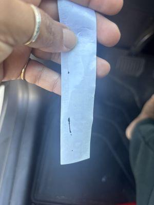 Peeling of the material due to the sticker.