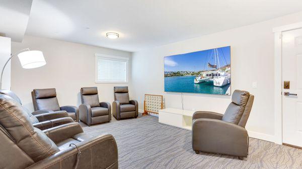 Large Media Activity room with large screen TV for fun shows! Ohana Hale Senior Living of Bellevue