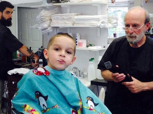 Johnny working on his grandson.