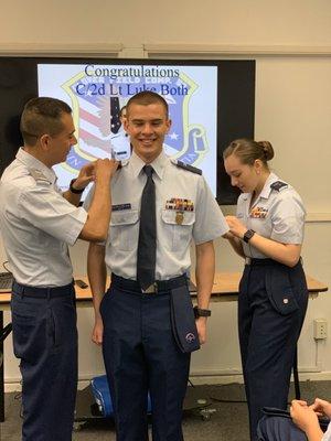 As a cadet run program, cadets deliver over 90% of the training of other cadets. This is a cadet being promoted by another cadet (right)