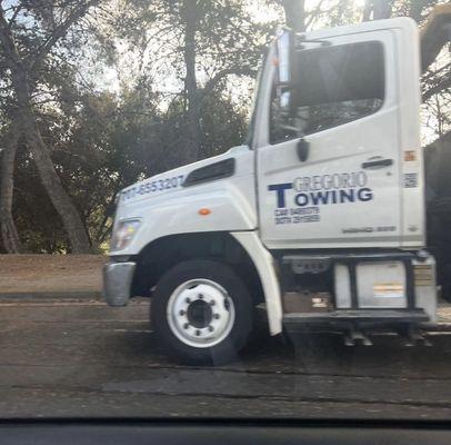 Company tow truck was seen abandoning black Benz on public road.