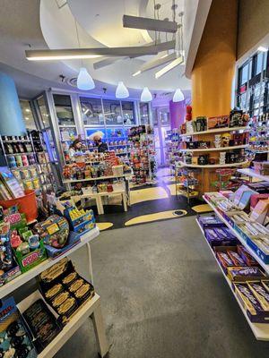 The store is completely full of merchandise yet there is enough room to move around.