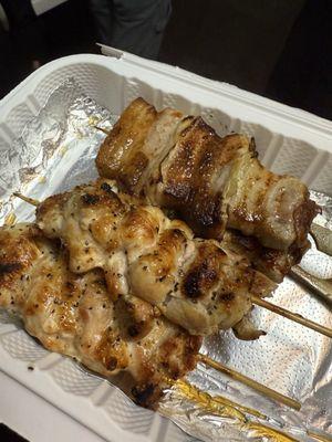 Pork belly on top side. Chicken thighs bottom. Each order comes with two skewers.