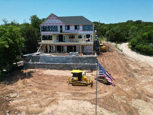 3 story build with retaining wall in Granbry