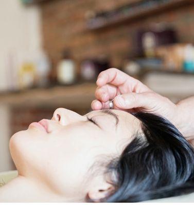 Calming the mind and body with the Acu point Yin Tang. Works like a charm.