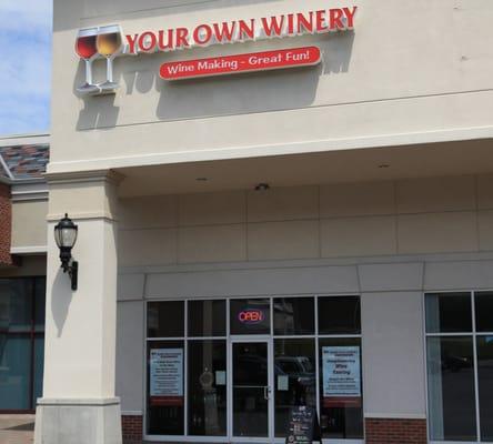 Beautiful Tuscany decor shop to Make Your Wine - not a Warehouse. Hard to miss the 3 foot Wine Glasses on Sign.