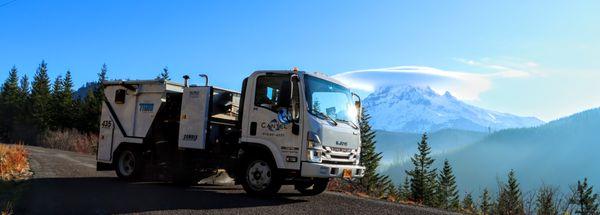 Cantel's sweeper truck with Mount Hood in the background