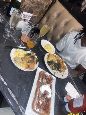 Banana Foster French Toast with Catfish Bites, Creamy Scrambled Eggs, Shredded Potato Casserole and Garlic Parmesan Brussels Sprouts