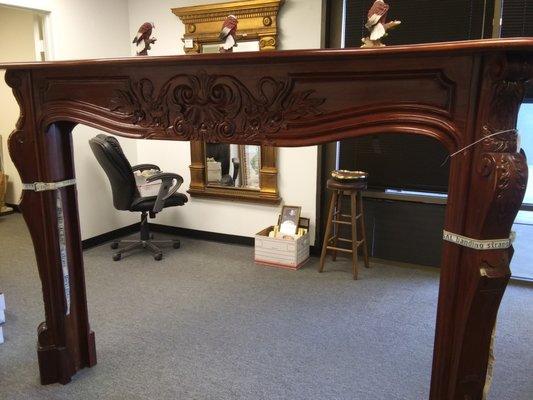 Hand carved wooden mantel is 84"Wx59"H. Closeout price $100.