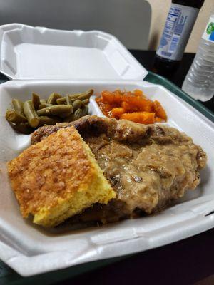 Smothered Pork Chop, yams, green beans, and cornbread