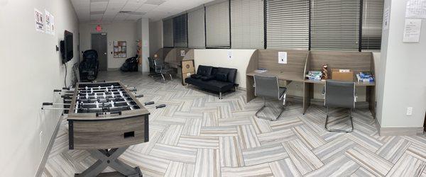 Another portion of relaxation area with massage chairs