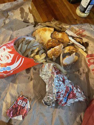 Remaining spicy chicken sandwich meal retrieved from the restaurant's trash {by employee} after interaction with employee (assumed manager.)