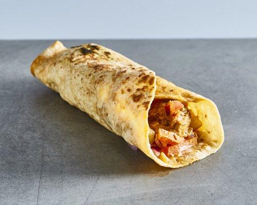 Chicken tikka masala wrap.
 
 Chicken marinated in spices.