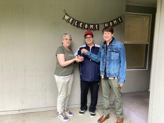 At the front door getting keys to our new home!