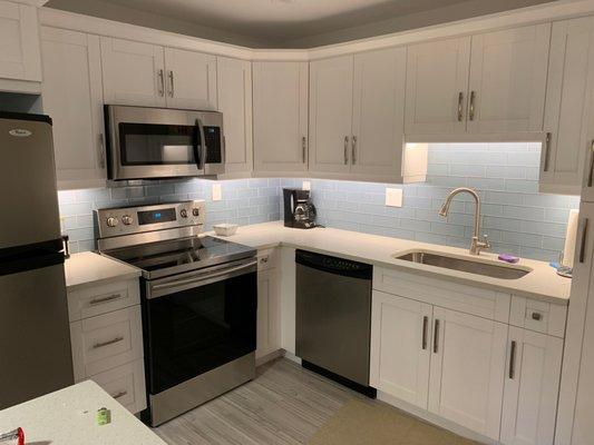 Fresh new kitchen: New cabinets & counter tops, backsplash, & floors.