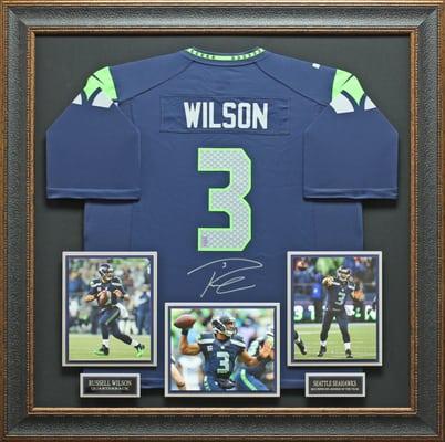 Russell Wilson Signed Seattle Seahawks Blue Jersey Display.