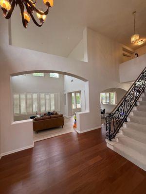 Ceiling is up to 20-23 ft. She completed an interior painting of the walls on the first floor.