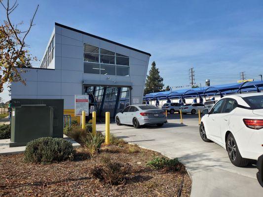 Waiting to enter the tunnel of car wash love.
