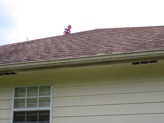 Walking the roof during home inspection.