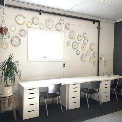 Our new office spaces hiding behind the crate wall!