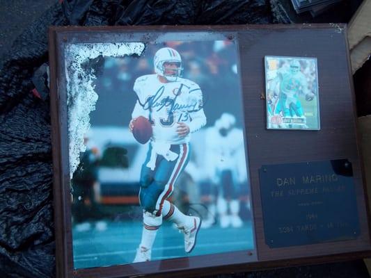A ruined signed and framed Dan Marino plaque... Madison Apartments did NOT want to buy it