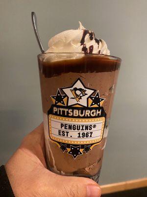 Chocolate mousse desert in souvenir glass from the dessert cart
