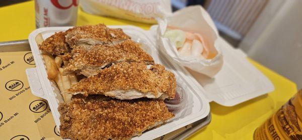 Huge chicken cutlet box with fries and shrimp chips. Spicy is pretty spicy.