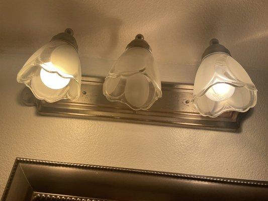 Rusted light fixtures with missing bulbs