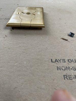 This floor outlet should be flush to the floor. It will never pass inspection.