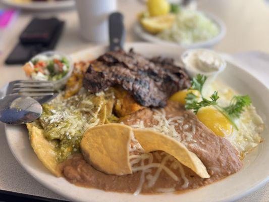 Chilaquiles with Carne Asada Red & Green salsa.