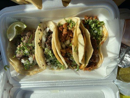 Carnitas, barbacoa, carne asada and chorizo tacos.