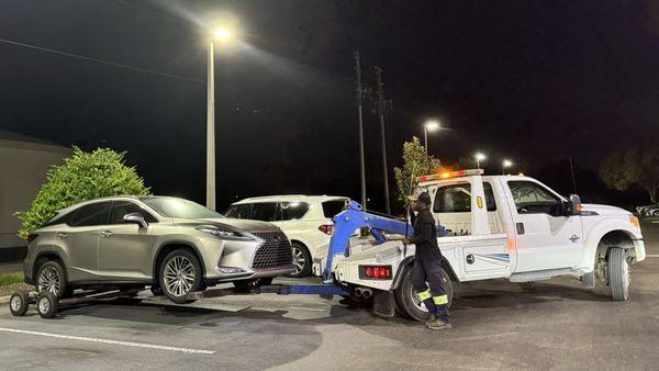 Ty from Day and Night Towing LLC with our disabled SUV following the surge from Hurricane Helene.