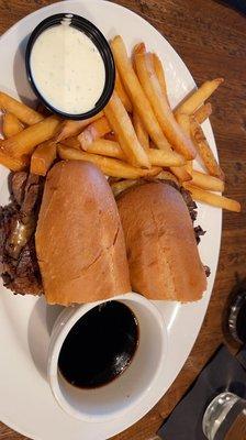 Prime rib sandwich with a side of fries