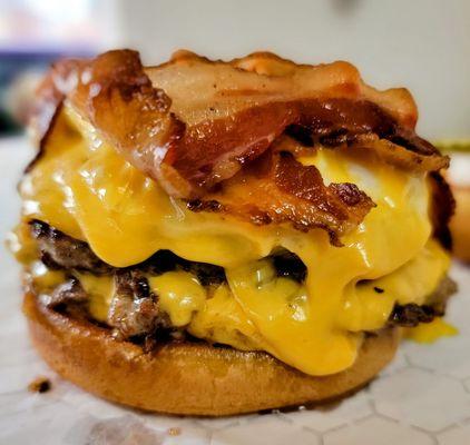 This is a beautiful display of gluttony. Double Cheeseburger, fried egg, and bacon.