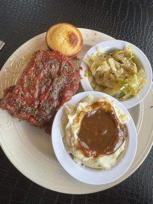 Meatloaf, cabbage, mashed potatoes, and cornbread