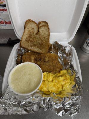 Catfish scrambled eggs with cheese, grits, and toast